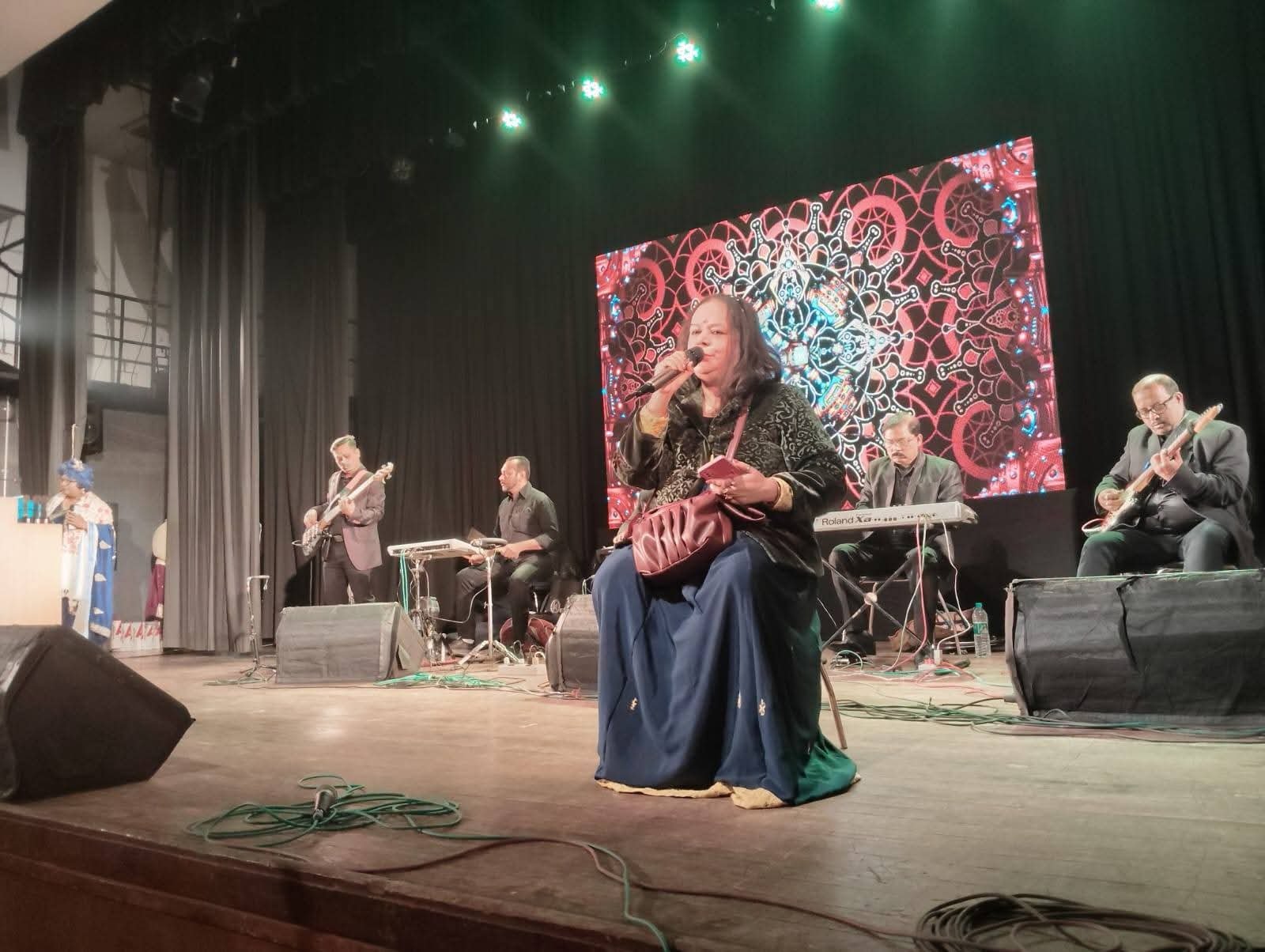 Banasri Ghoshal in concert with a live band at a Kolkata auditorium