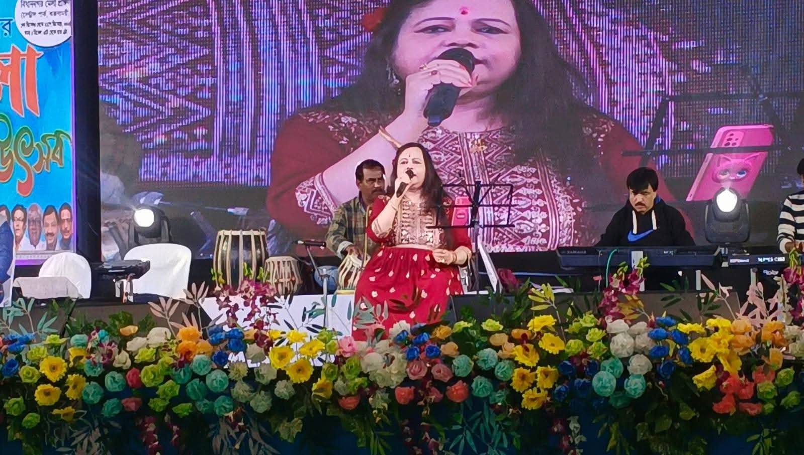 Banasri Ghoshal singing before a large festival audience