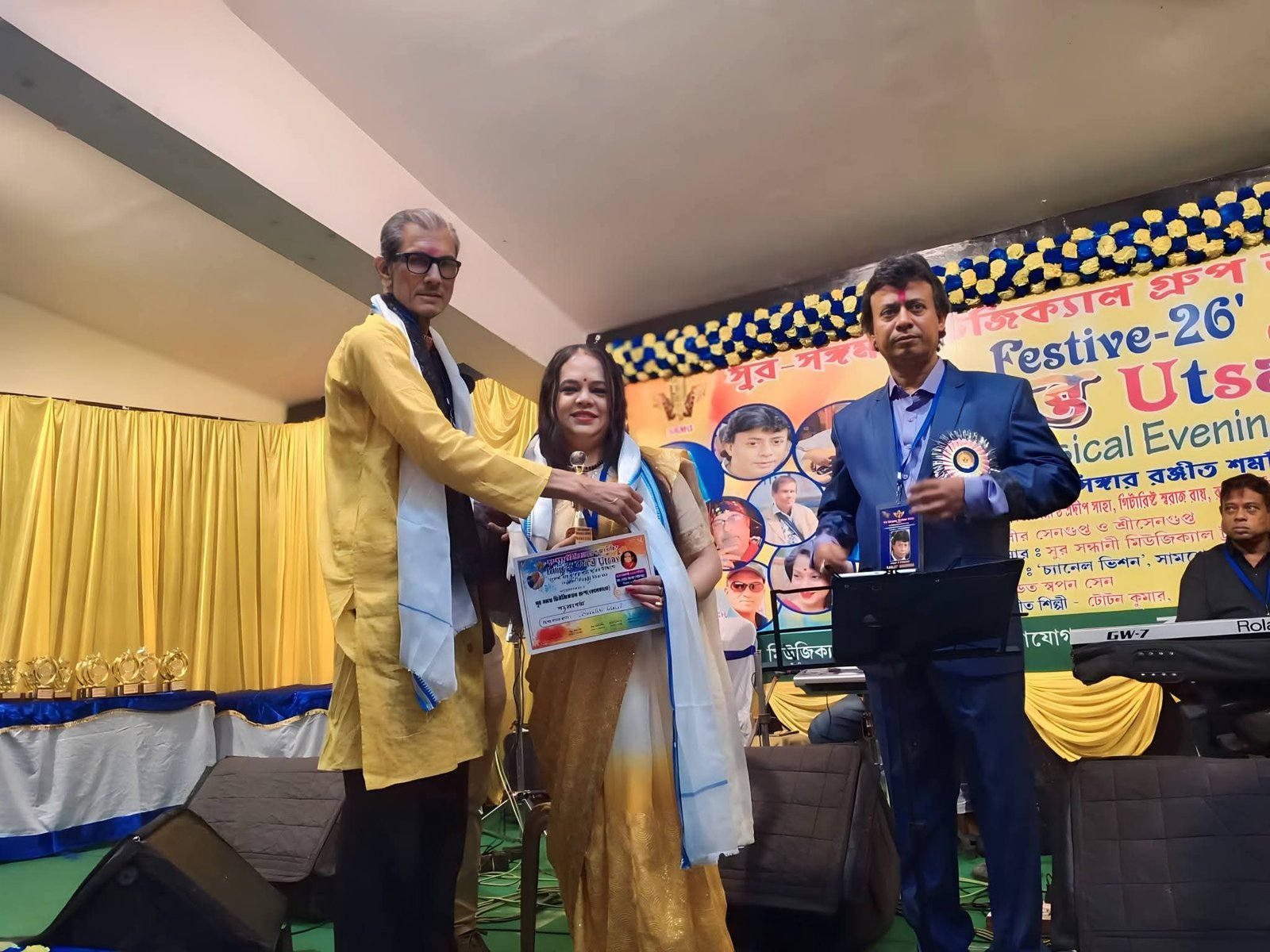 Banasri Ghoshal receiving an award on the Festive-26 stage