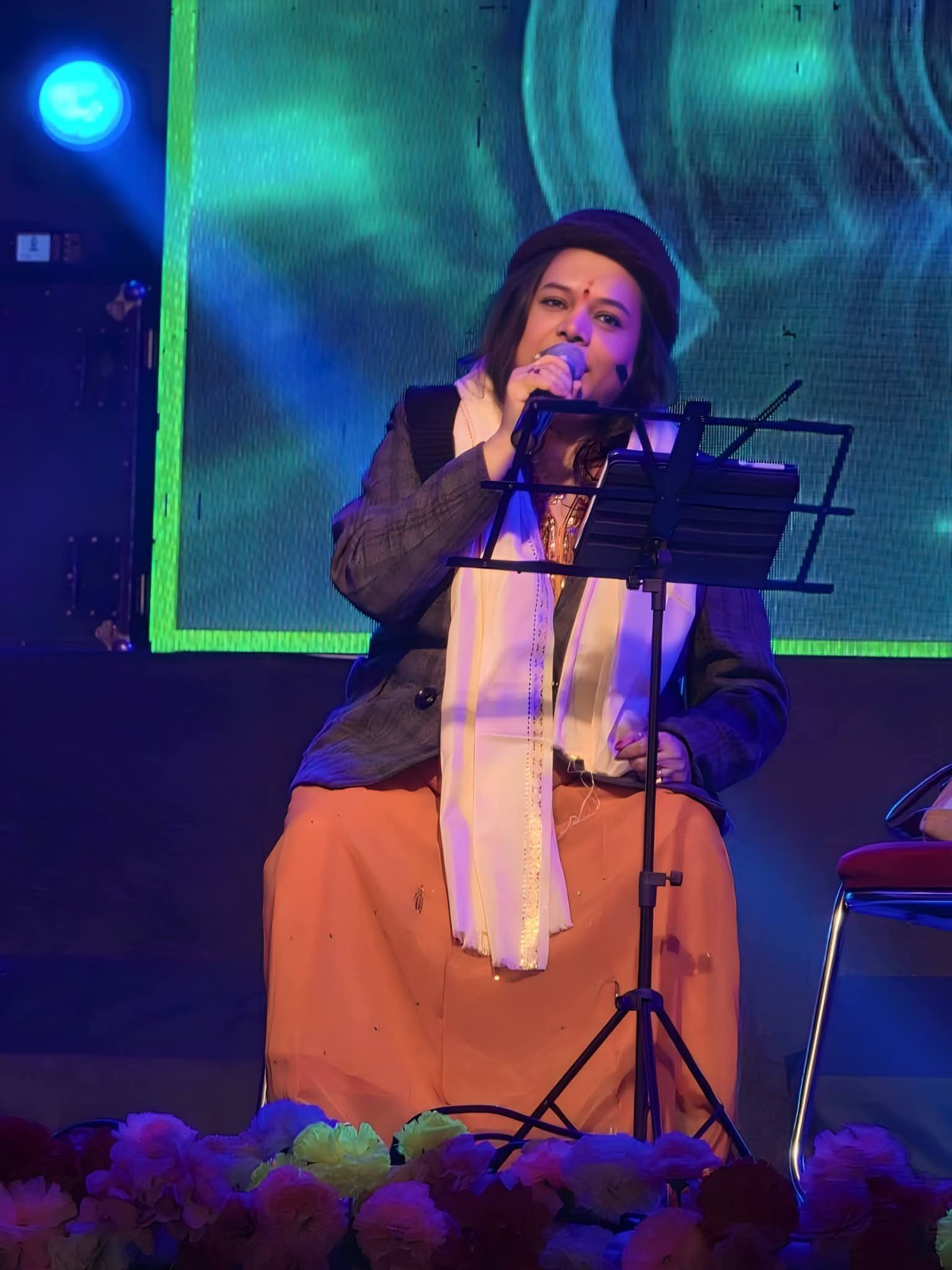 Banasri Ghoshal performing under stage lighting